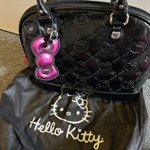 Hello kitty hand bag . Black and pink in excellent condition vintage .